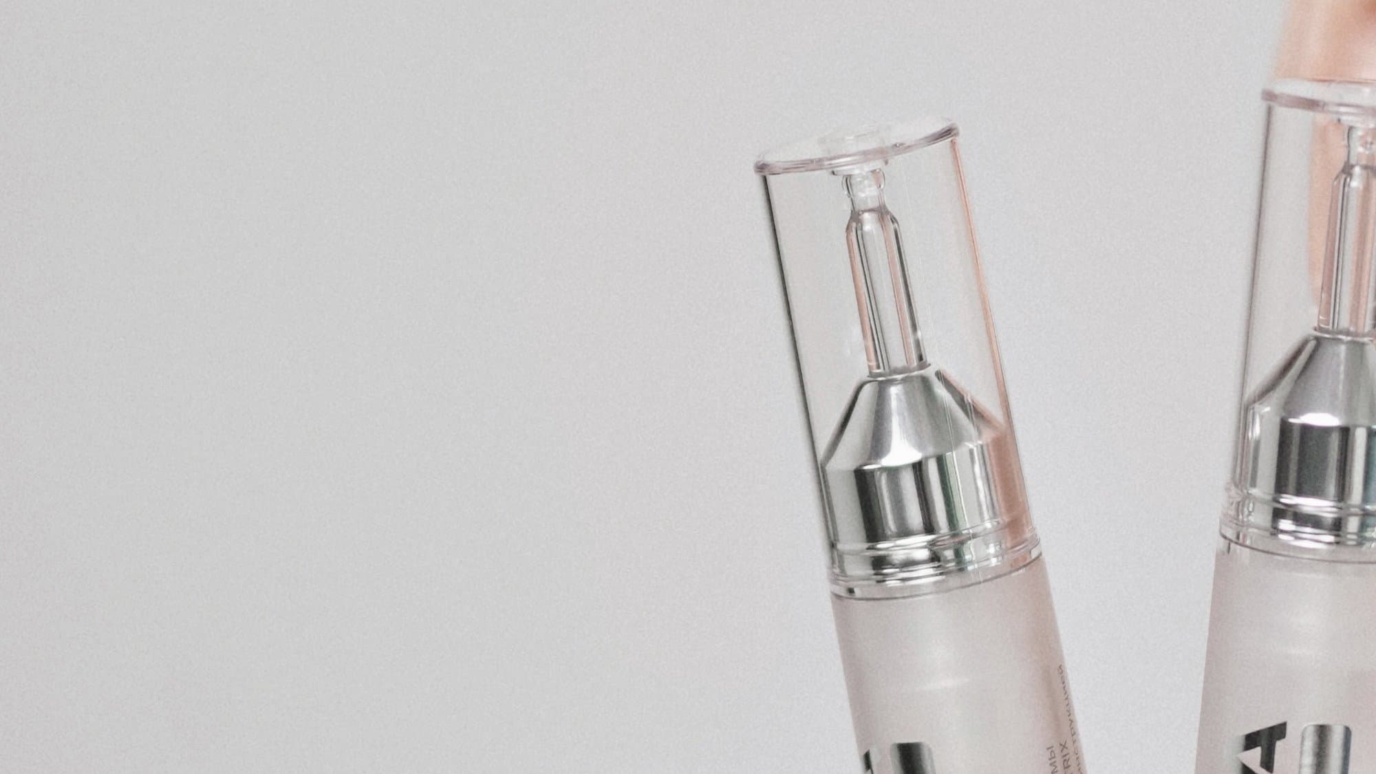 Two MOMA MATRIX ampoules in close-up on a light background