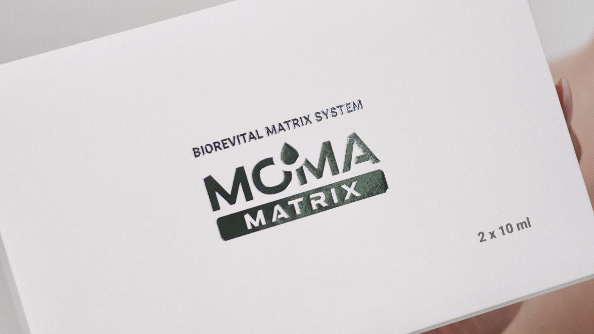 The MOMA MATRIX Biorevital Matrix System course box held in hands