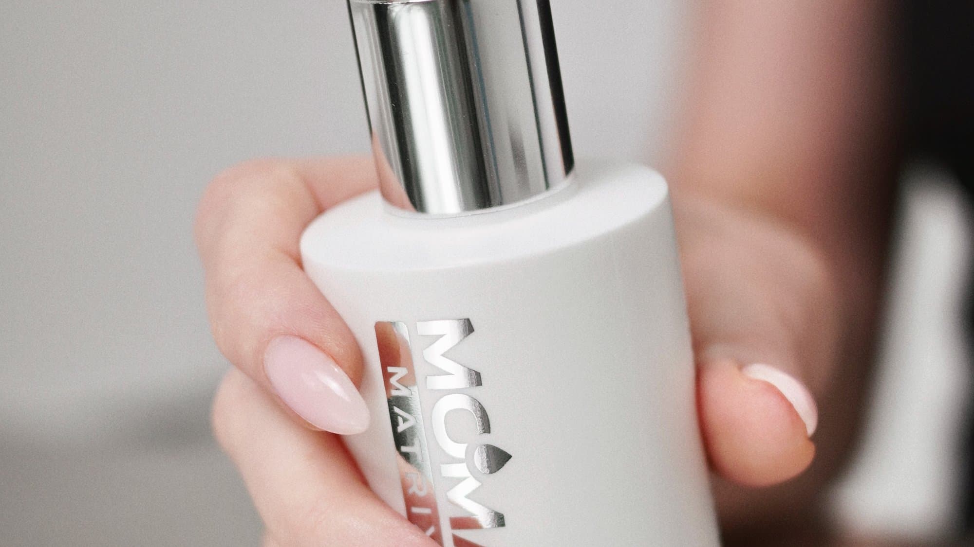 A MOMA MATRIX bottle in hand, close-up