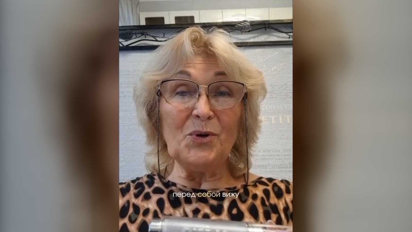 Elena Tkachyova speaking to camera, a still from the video